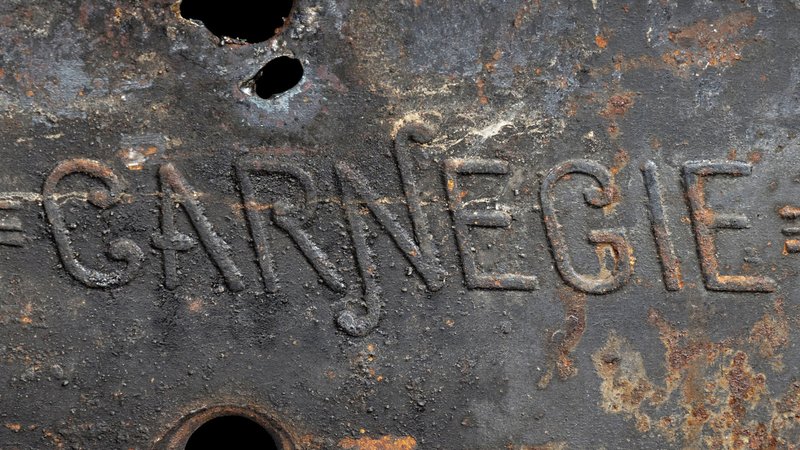 Close-up of the name "Carnegie" embossed in steel
